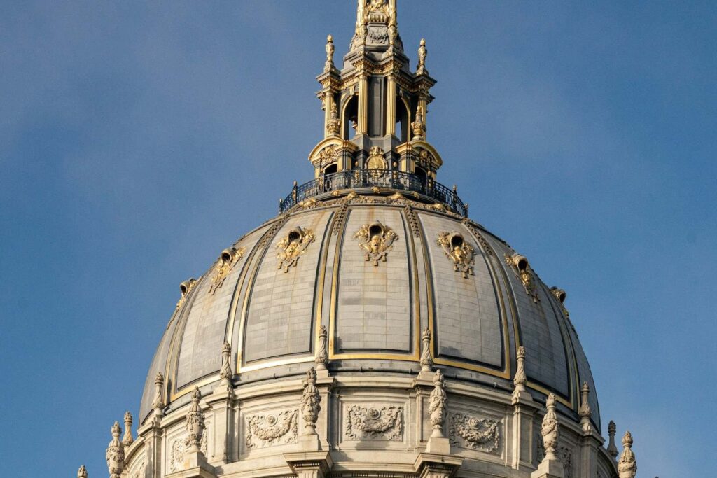 The dome of a civic building against a clear sky